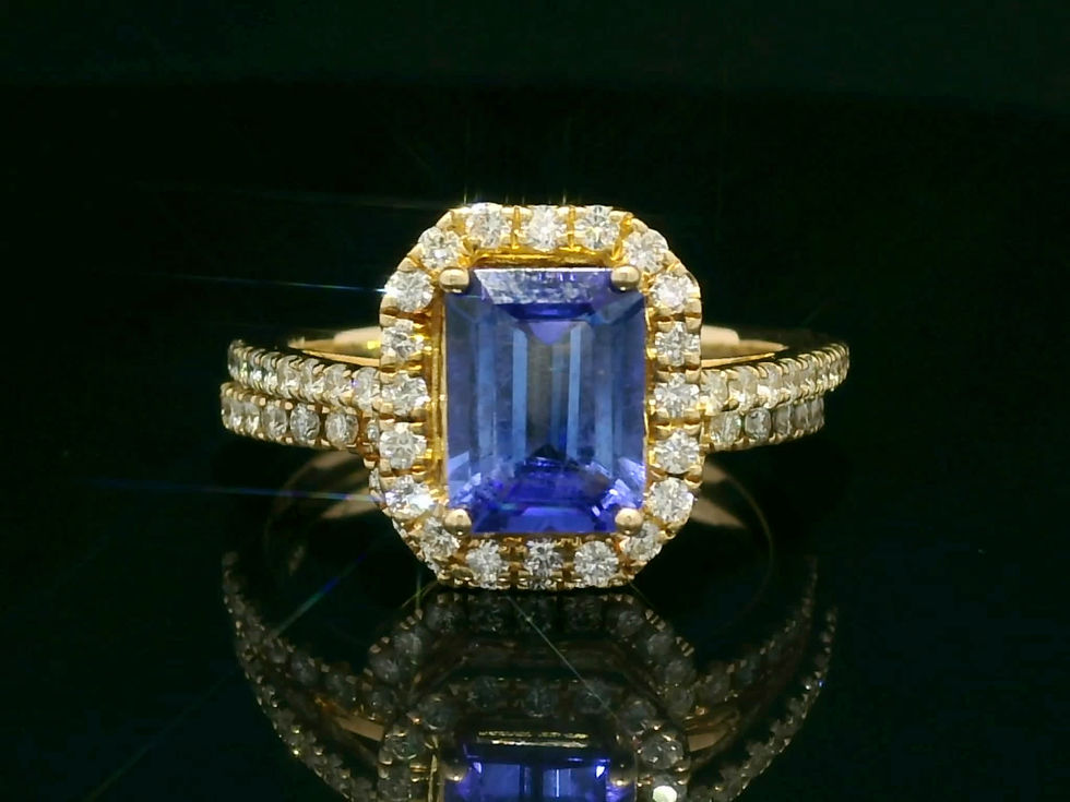 Thumbnail: Emerald-Cut Tanzanite Halo Ring in Yellow Gold with Diamond Accents