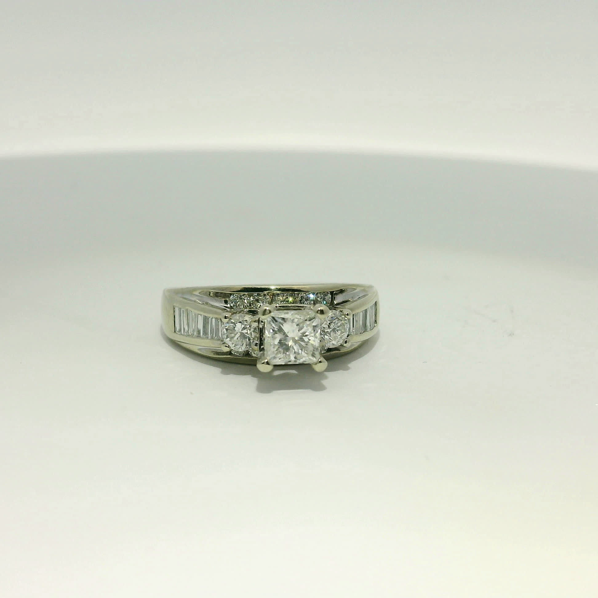 Princess and Round Brilliant Diamond White Gold Three-Stone Ring with Baguette