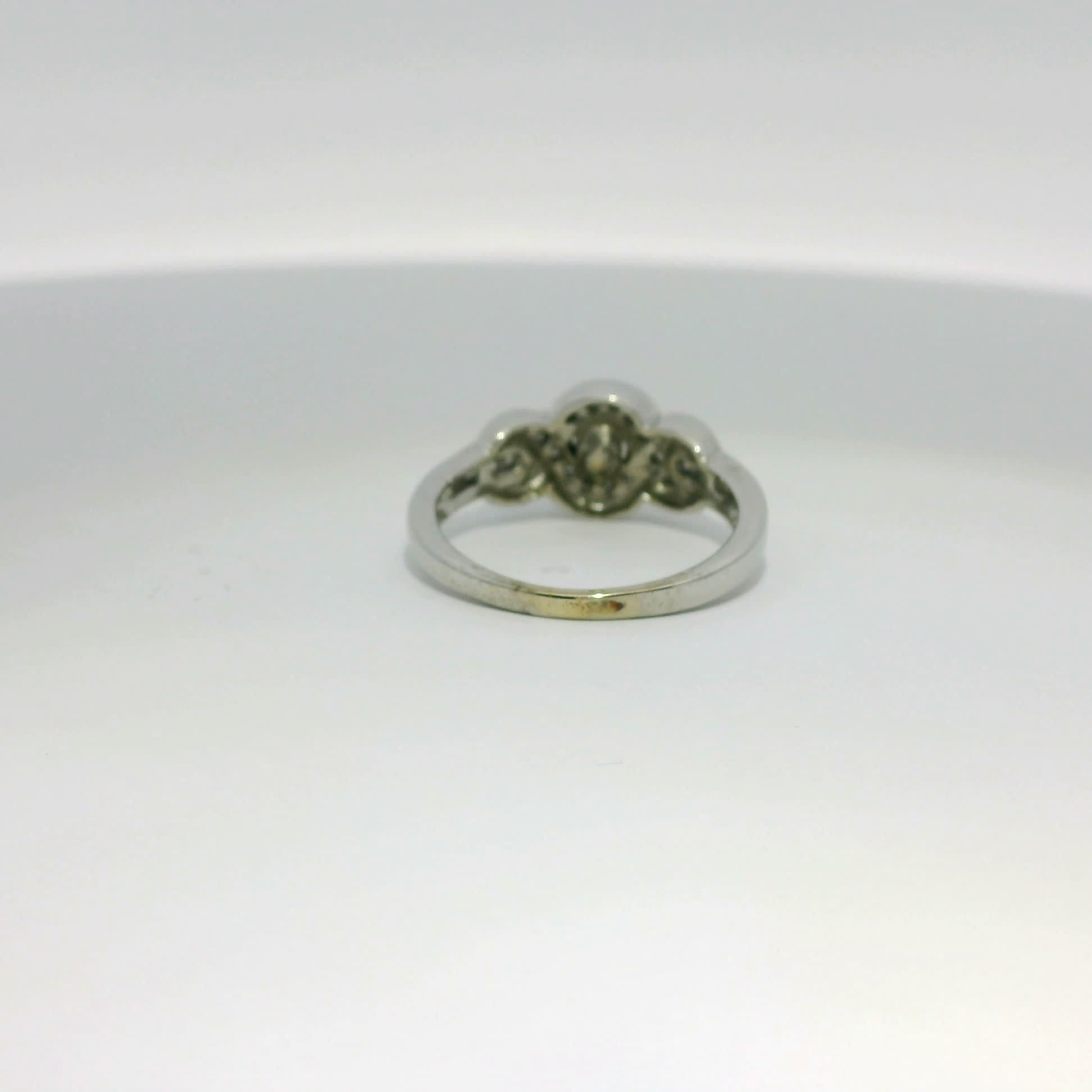 Round Brilliant Cut Diamond Halo Crisscross Engagement Ring in White Gold