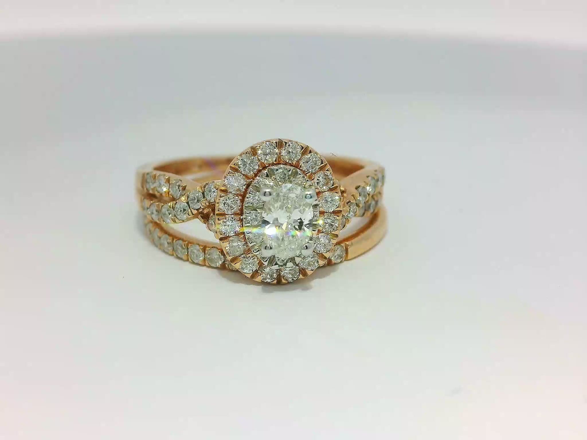 Oval Brilliant Diamond Halo Rose Gold Bridal Set with Twisted Infinity Shank