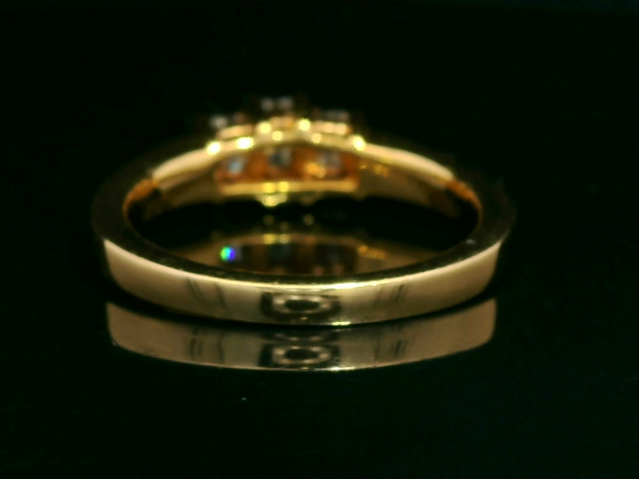 Emerald-Cut Diamond Three-Stone Ring in Yellow Gold