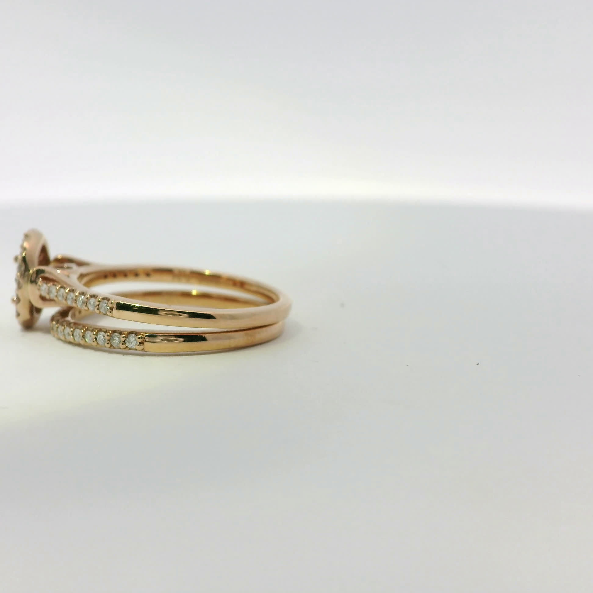 Rose Gold Round Cut Diamond Halo Engagement Ring and Wedding Band Set