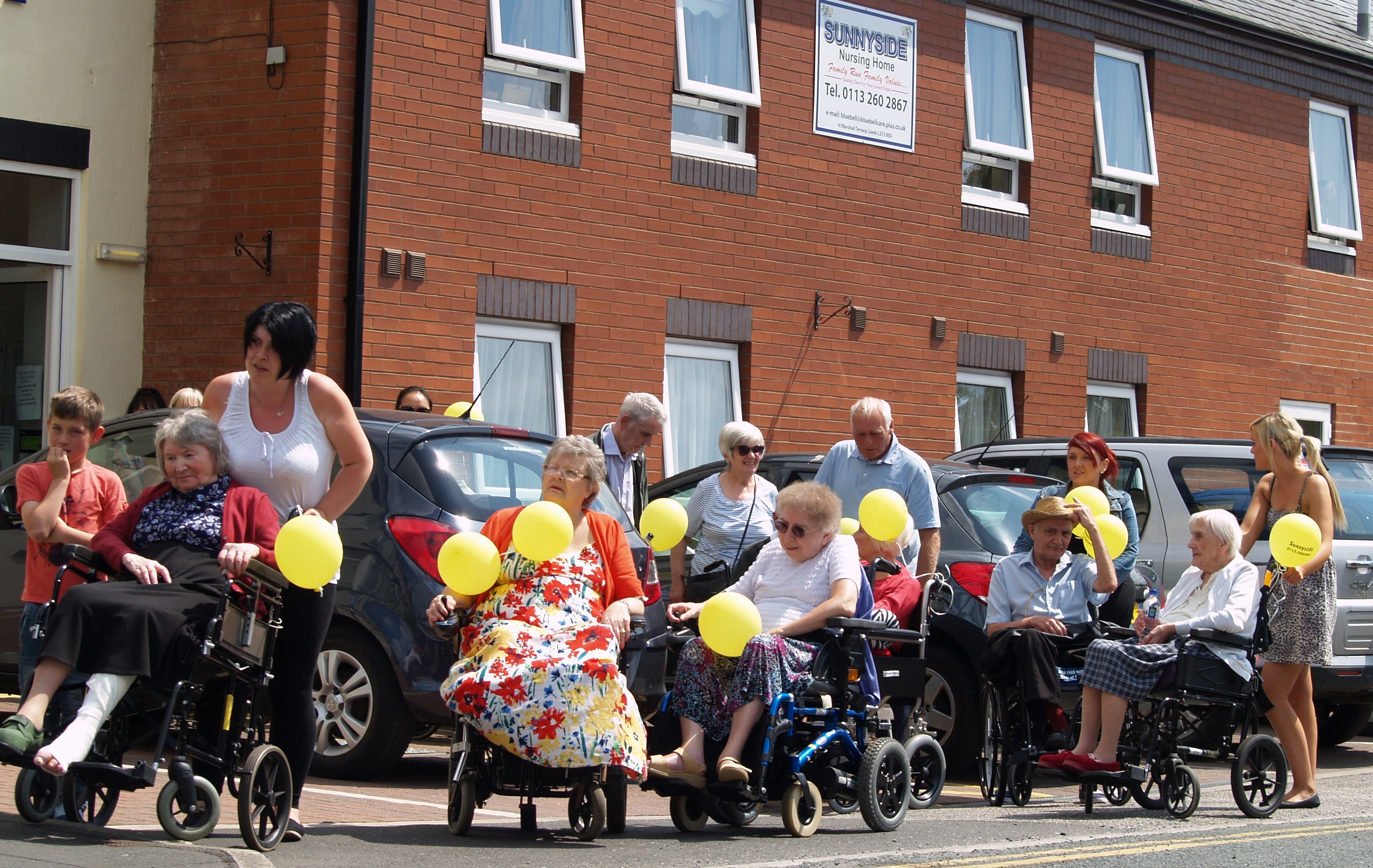 Walk a Mile charity event - staff pushing residents through Crossgates