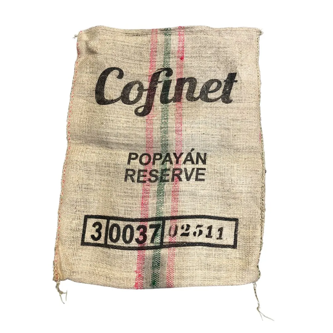 an empty coffee bean hessian sack with white background