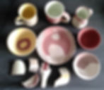 Some glazed pre-fired pots