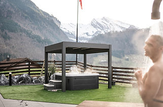 Private outdoor whirlpool at Villa Tauris with Swiss Alps views