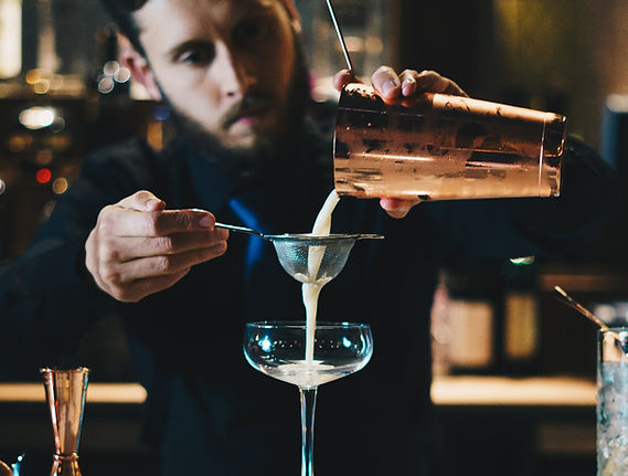 man in black suit jacket holding clear w