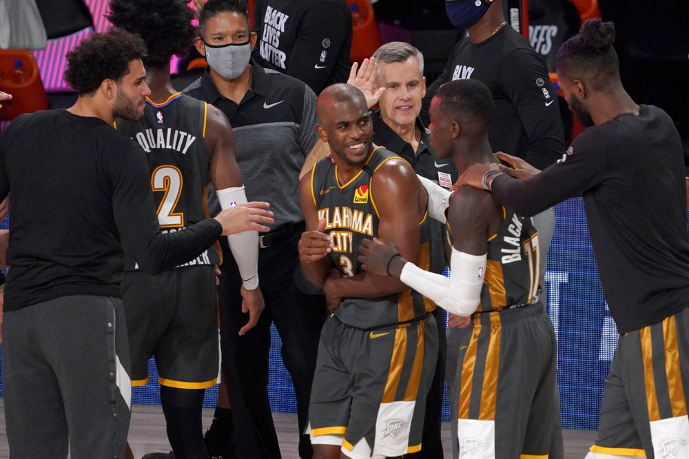 Chris Paul celebrates with his teammates after defeating the Houston Rockets in game 6. (Photo Credits to Mark of AP Sports)