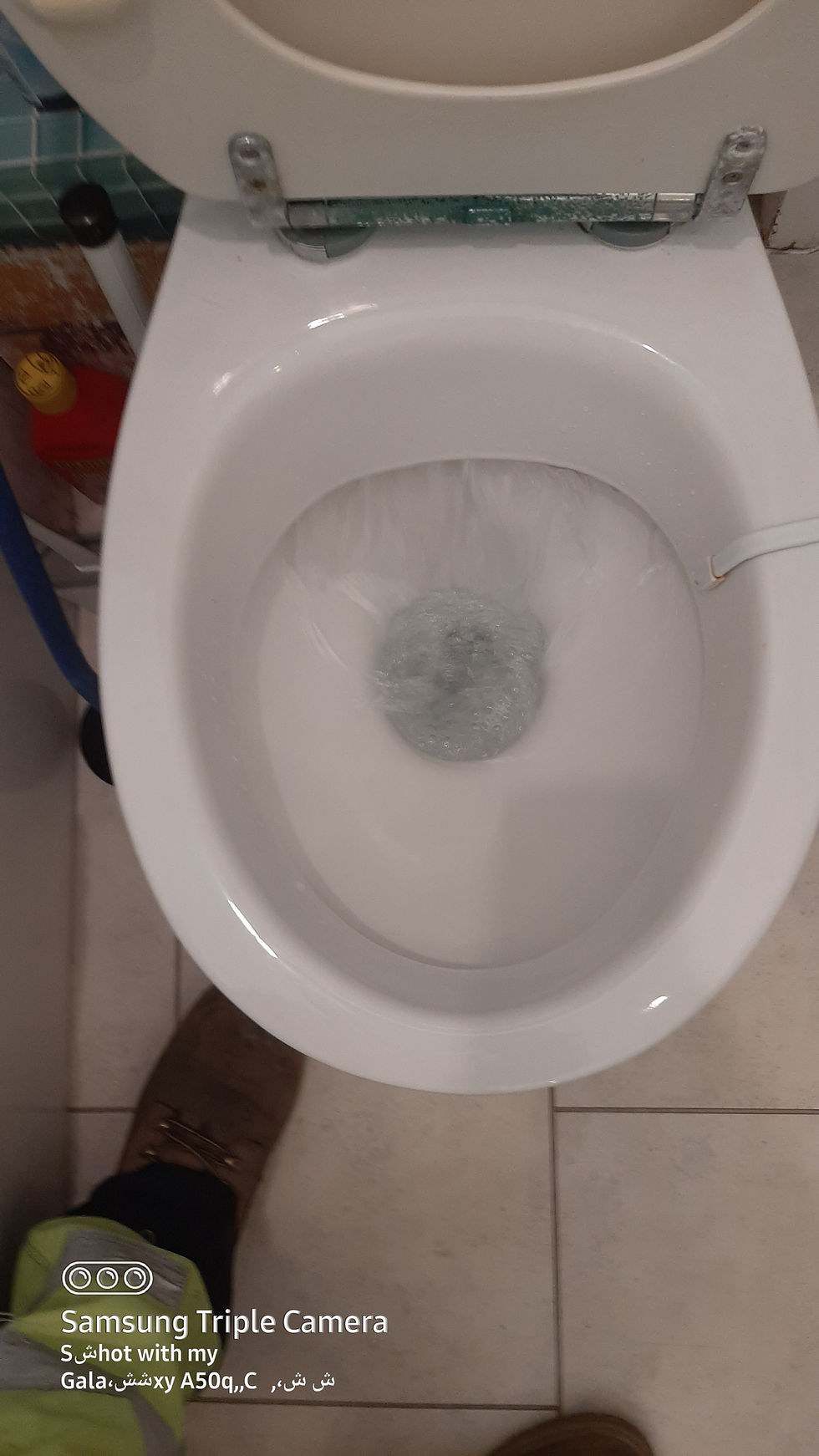 Clean toilet bowl with flushing water at the Clifton Bristol toilet clearance job