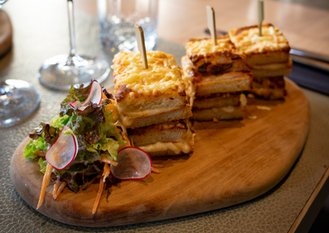 BBQ ham and cheese croque monsieur with salad on the side.