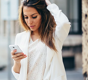 Businesswoman in white.webp