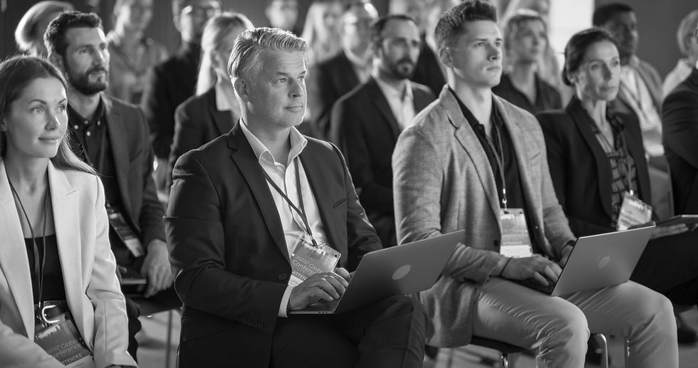 A physician learning at a medical practice management conference