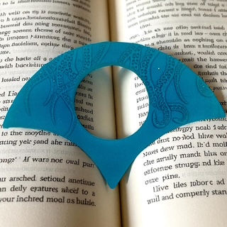 Thumb book page holder as book lover gifts and gifts for a reader.