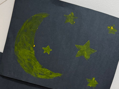 black construction paper with sun and moon