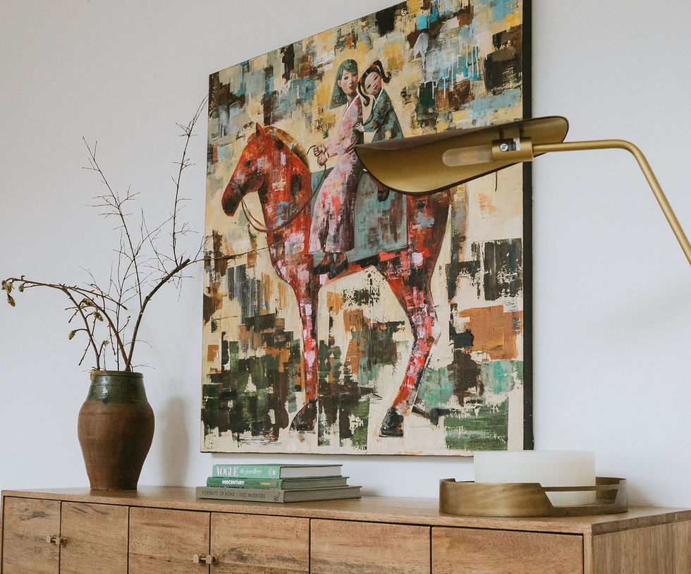La Cañada residence walnut credenza styled with abstract artwork, pottery and branches, by Corrine K Concepts, Los Angeles interior designer