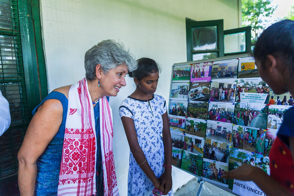 Location- Nahartoli Tea Estate ; Dr. Yasmin Ali Haque going through photographs of various activitie