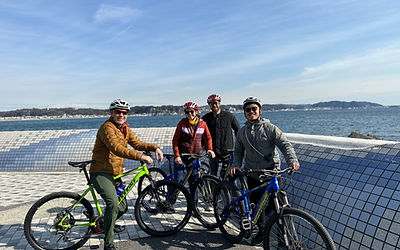 A cyclist stopping to take a commemorative photo