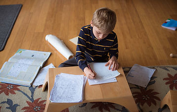 Child concentrating on writing