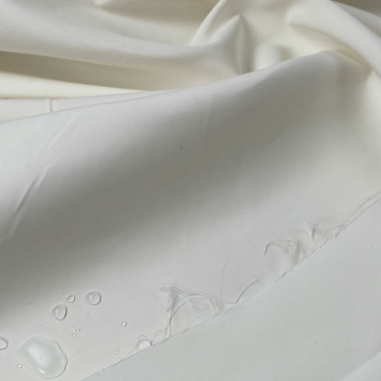 Ex-designer, water-resistant, raincoat fabric with silk, off white, per 0.5m