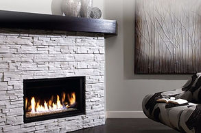 a zero clearance fireplace with a brick surround