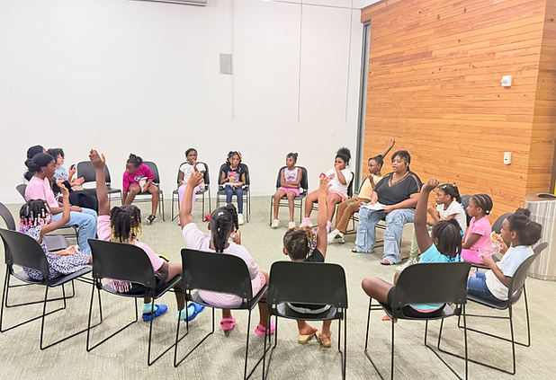 Young girls talking to counselor