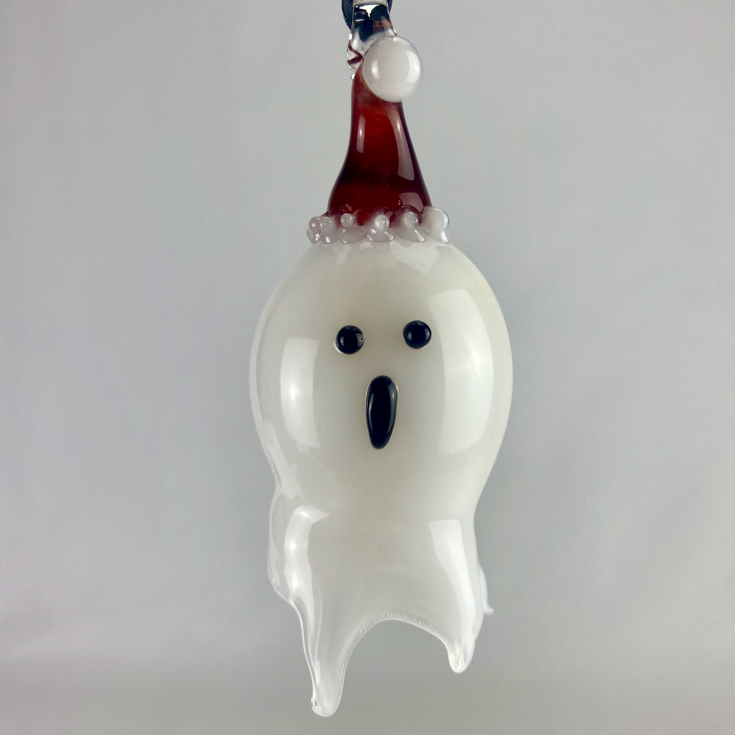 Blown Glass Ghost Ornament with a Santa Hat