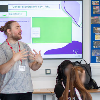 Facilitator Will Hudson leading a workshop in a secondary school classroom.