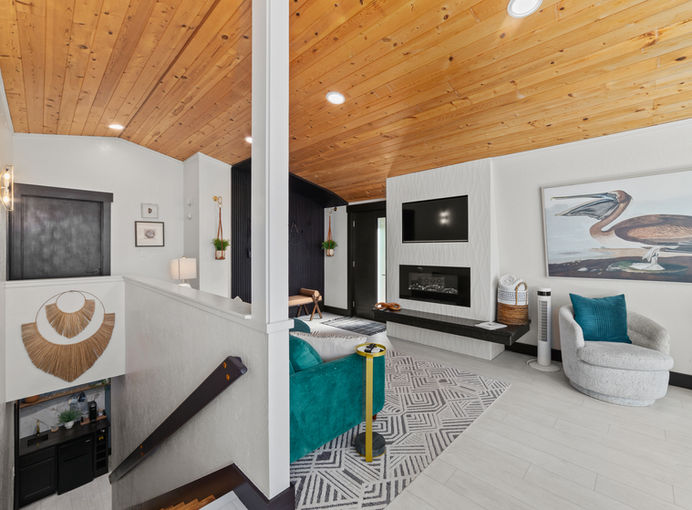The Beach Barn-Living Room with stairs that lead to lower level