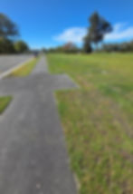 Paved path next to a neatly mown green lawn, Christchurch
