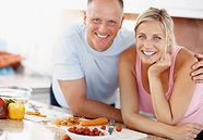 happy couple in home kitchen