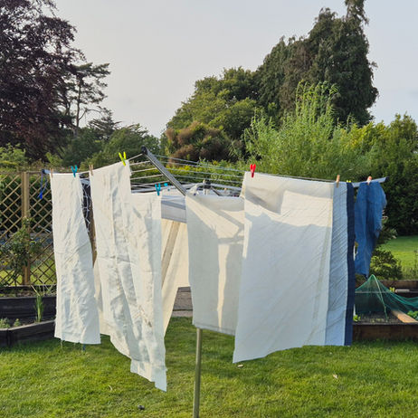 Washed Sail hanging on Washing Line in Garden