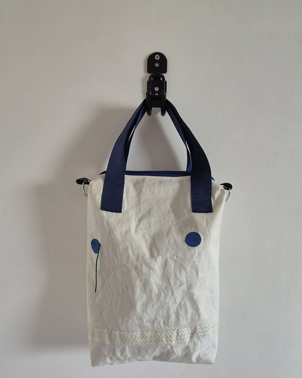 Thumbnail: white Sail bag with blue tell tale on the front, blue top handles and original stitching