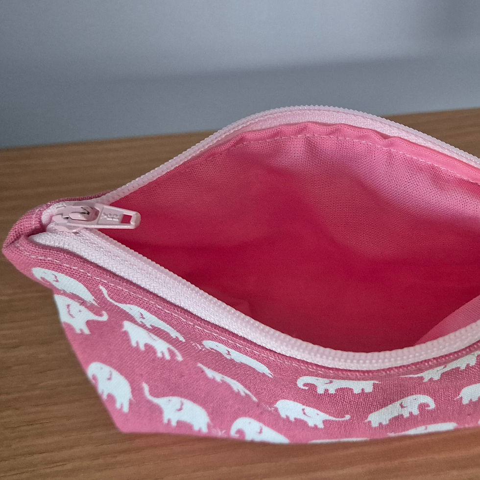 Thumbnail: small pink pouch with white elephant print and light pink zip and pink interior fabric