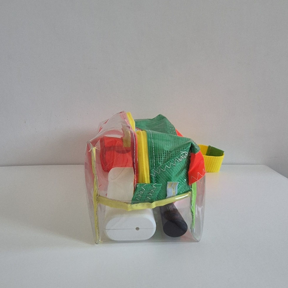Thumbnail: side of a pencil case with pink base with clear base, yellow zip and green on left
