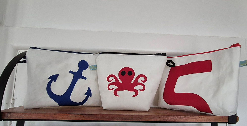 three small White Sail Bags each with a different application on front.