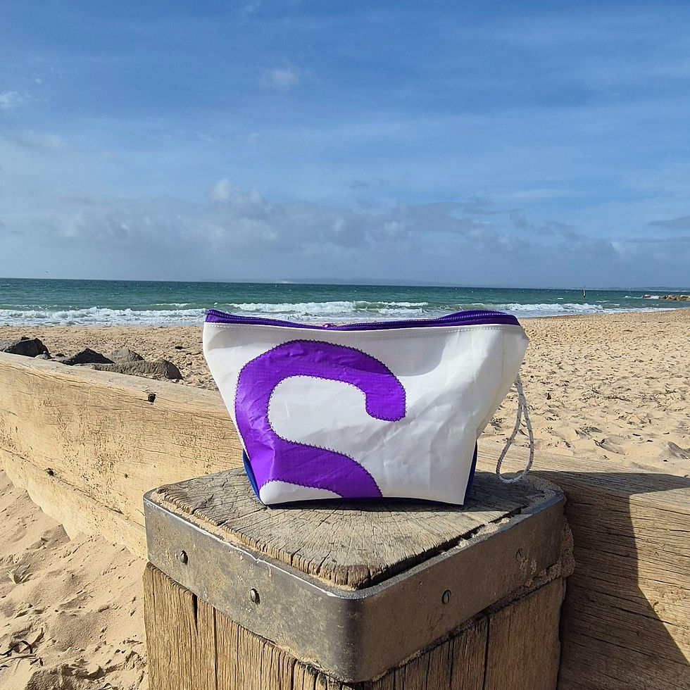 white washbag with coloured nautical number on the front