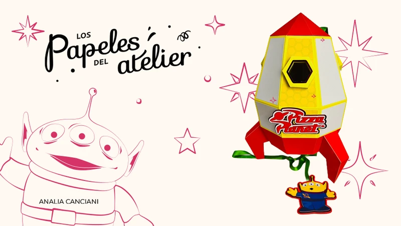 Cohete 3D de Toy Story hecho en papelería creativa para centro de mesa, con detalles en capas de papel y luces. Portada de la Clase 1 de Agosto de la Escuela de Papelería Creativa de Analía Canciani