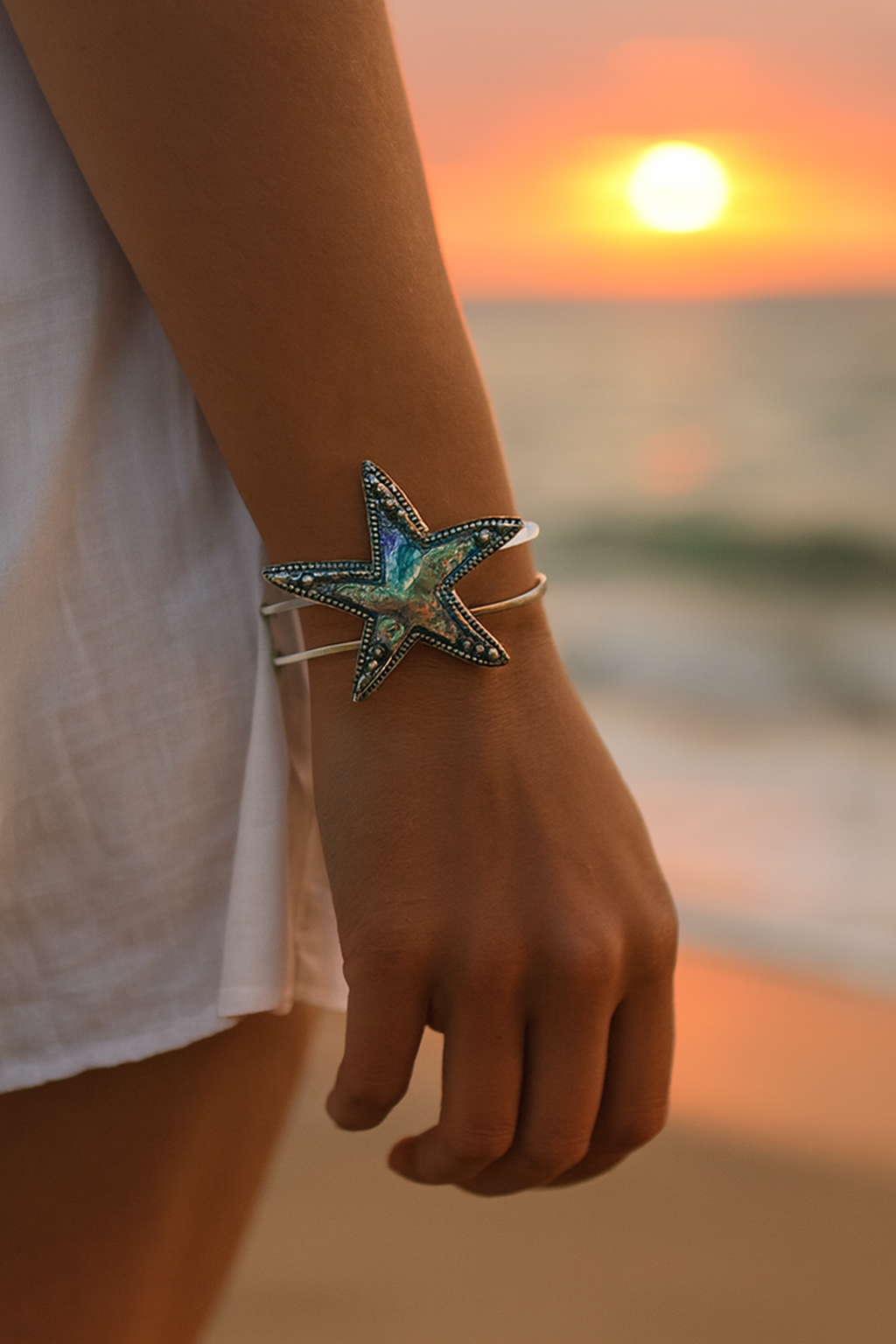 Girl wearing abalone starfish hinged bracelet