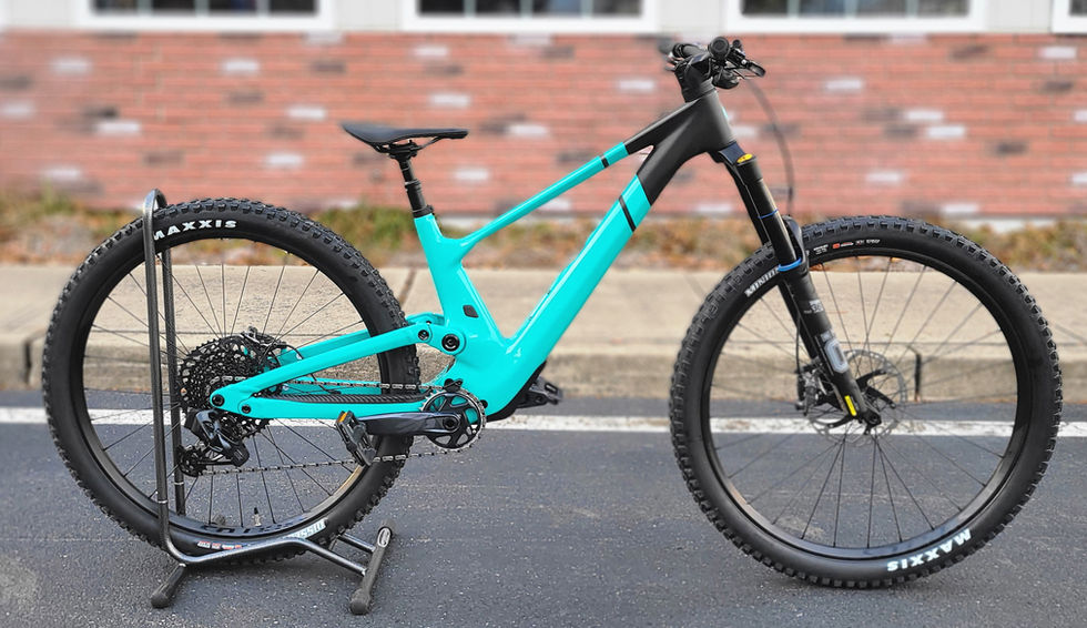 Black and turquoise full suspension moutain bike