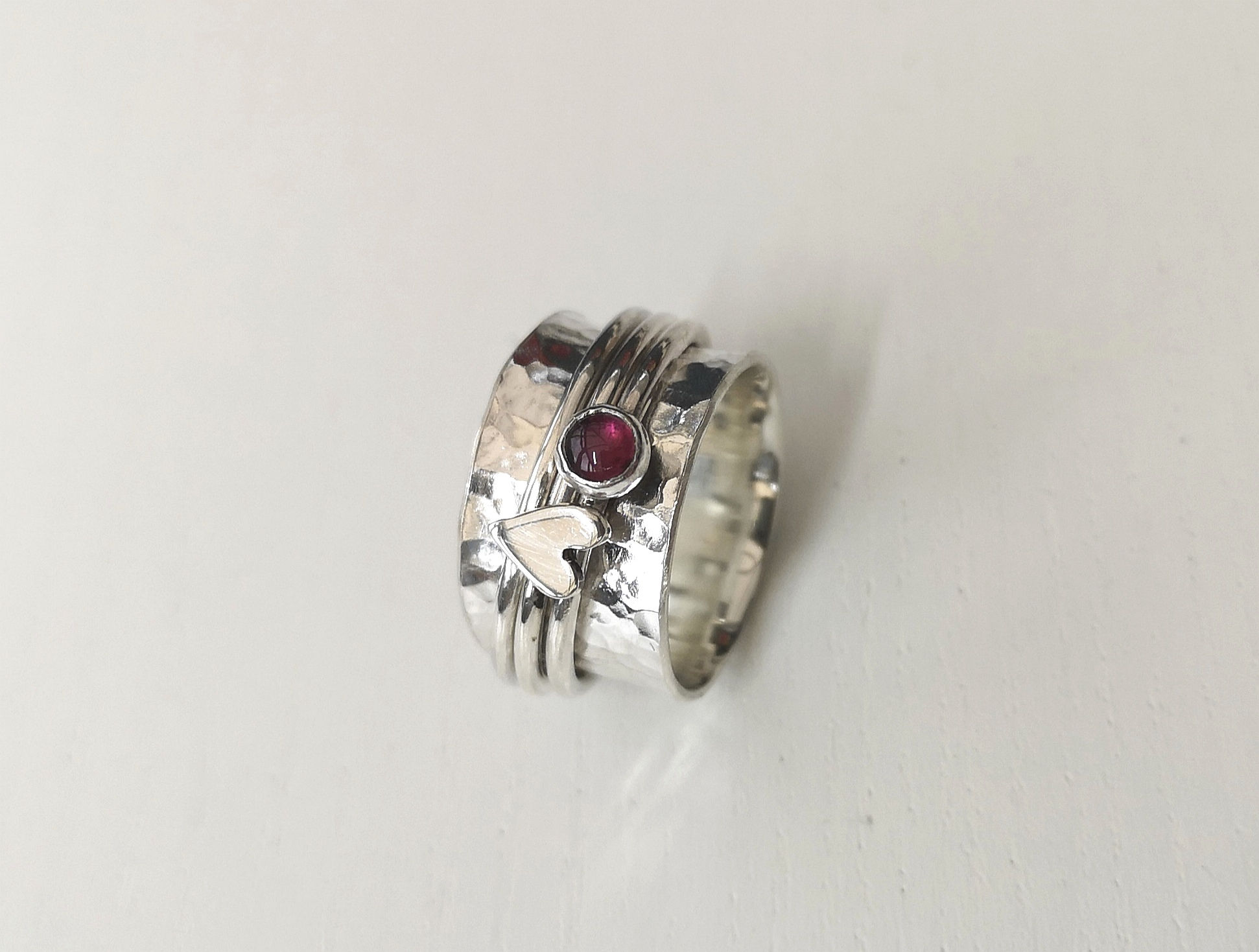 Garnet and heart spinner ring