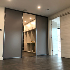 dark-grey-sliding-doors-for-walk-in-clos