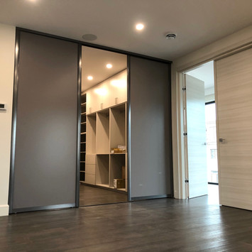 dark-grey-sliding-doors-for-walk-in-clos
