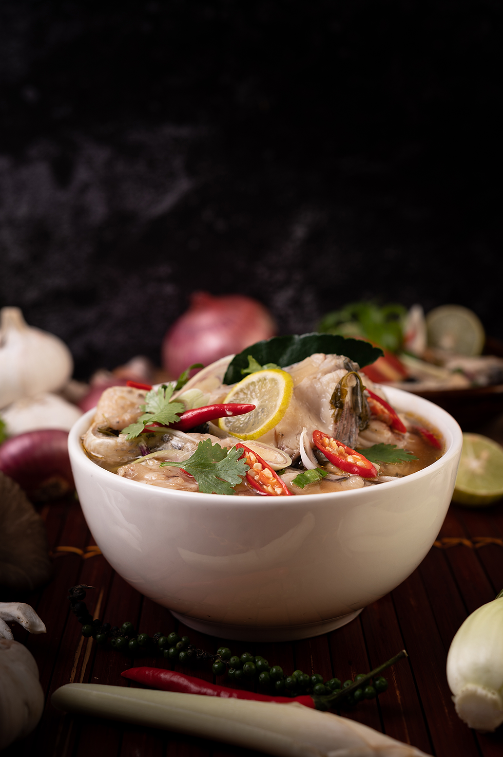 boiled-fish-infusion-with-tomatoes-mushrooms-coriander-spring-onion-lemongrass-bowl.png