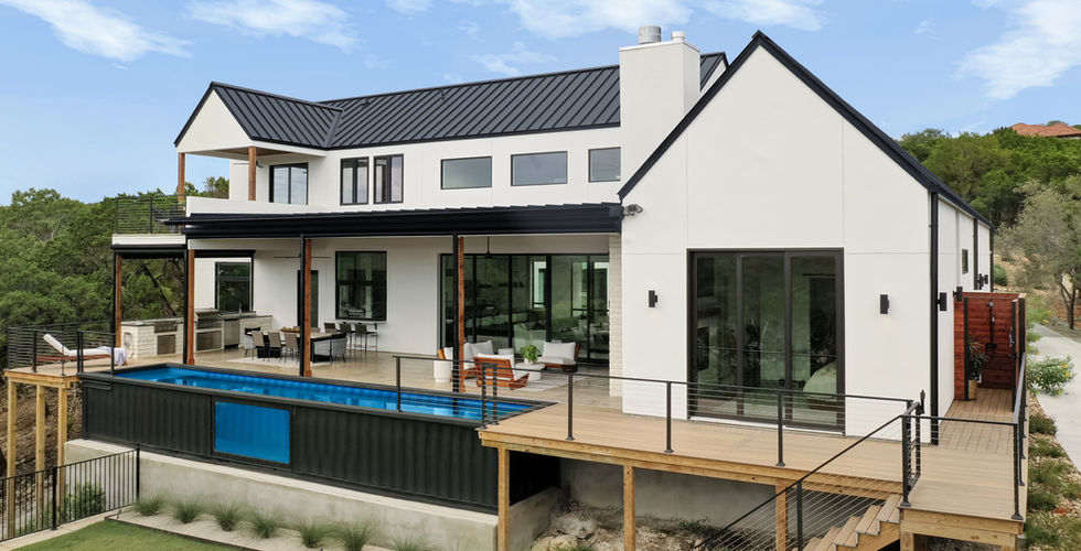Two story rear exterior with a modern container pool