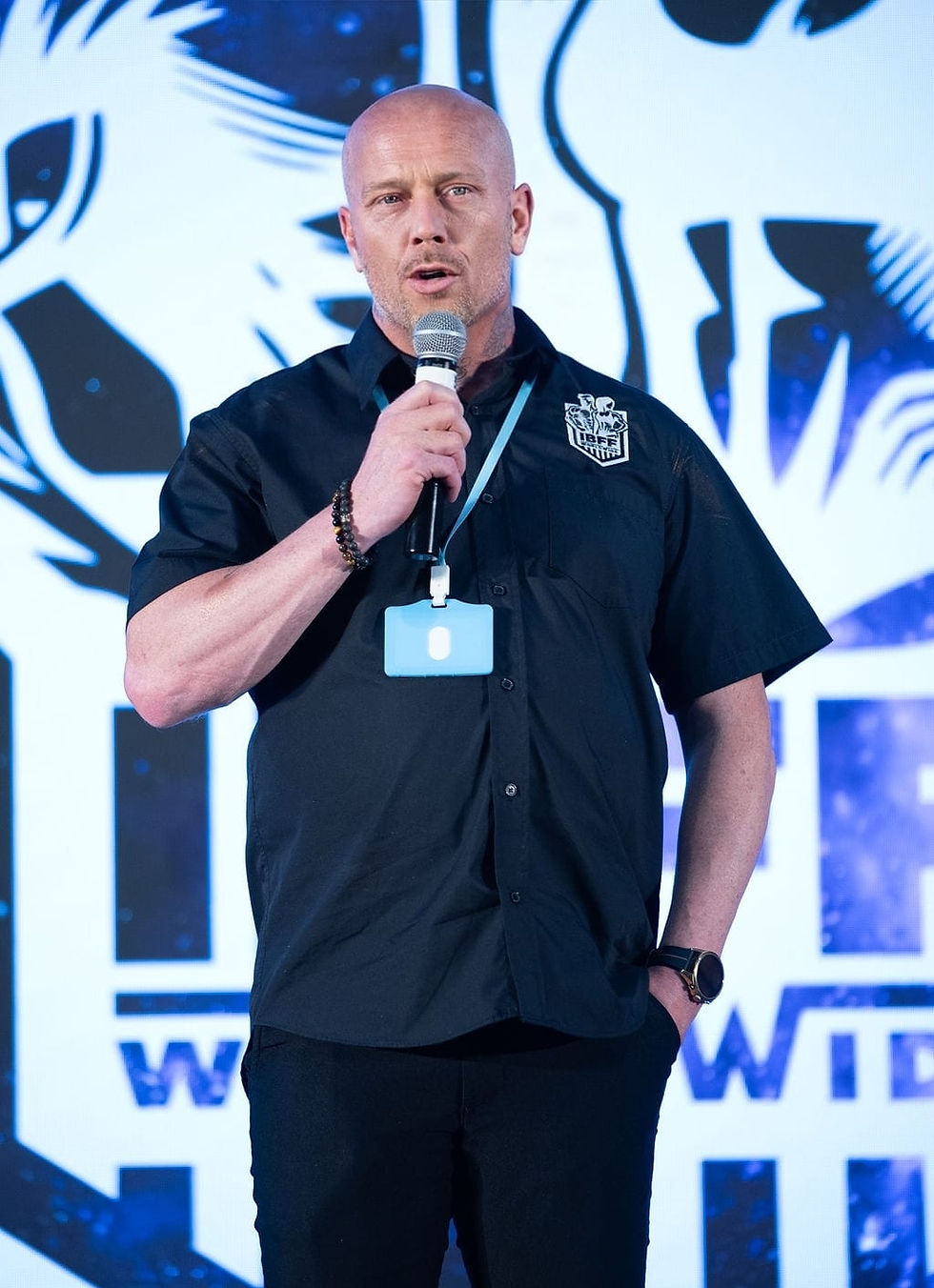 Will, the founder, giving a talk on stage.