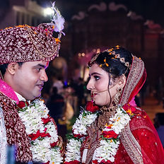 Emotional jaymala moment captured by FotowalkStudio, Patna weddings.