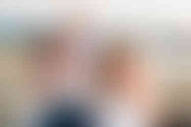 Family of five taking family portraits at the beach