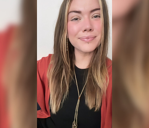 [Image of Suzie Wise. She is wearing a black top with clay coloured cardigan and has brown with blonde hair]