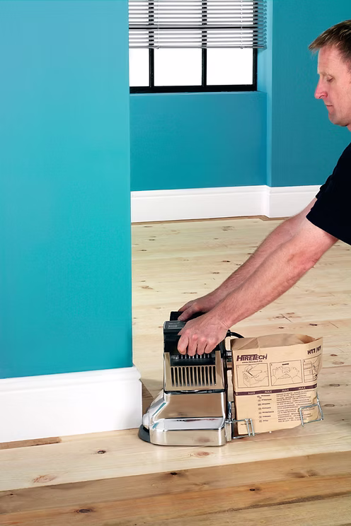 Floor sanding hire Bendigo – HT7 edge sander in action sanding timber floor edges along skirting boards