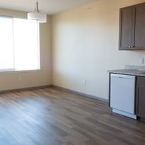 The Atrium at Austin Bluffs -  Our Affordable Housing property dedicated to seniors on a fixed income - the living room of one of our 52 units
